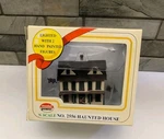 Model Power 2556 Scale Assembled Haunted House Lighted W/figures Tested. Fixed Price $19.00.