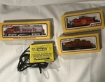 Life-like Ho Santa 8294 High Nose GP38, Caboose, Tank Car And Power Pack Lot. Fixed Price $54.49.